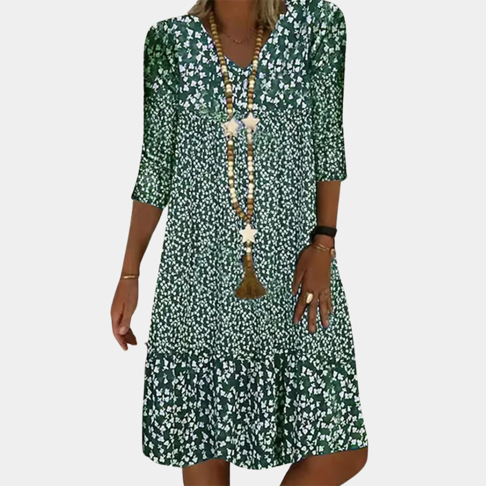 "Elegante Ottilie midi zomerjurk voor dames met V-hals, verfijnde pasvorm, ademende stof en levendige kleuren."