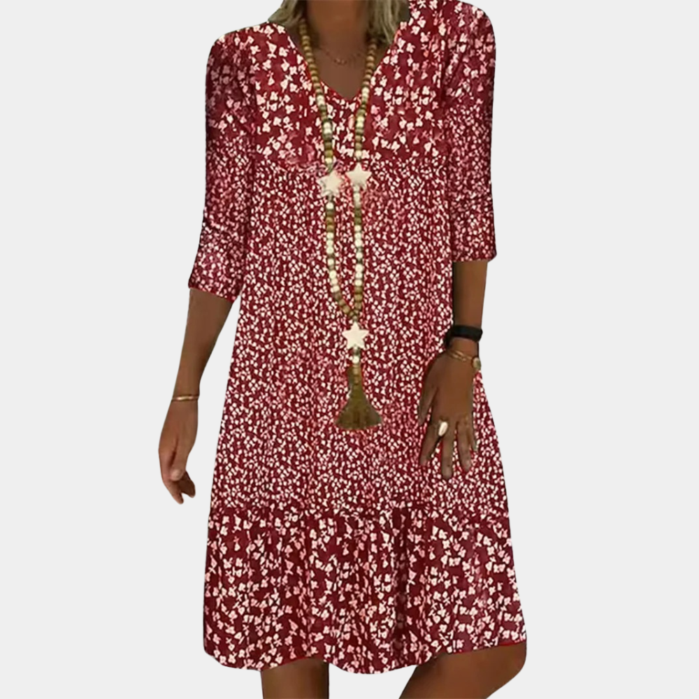 "Elegante Ottilie midi zomerjurk voor dames met V-hals, verfijnde pasvorm, ademende stof en levendige kleuren."