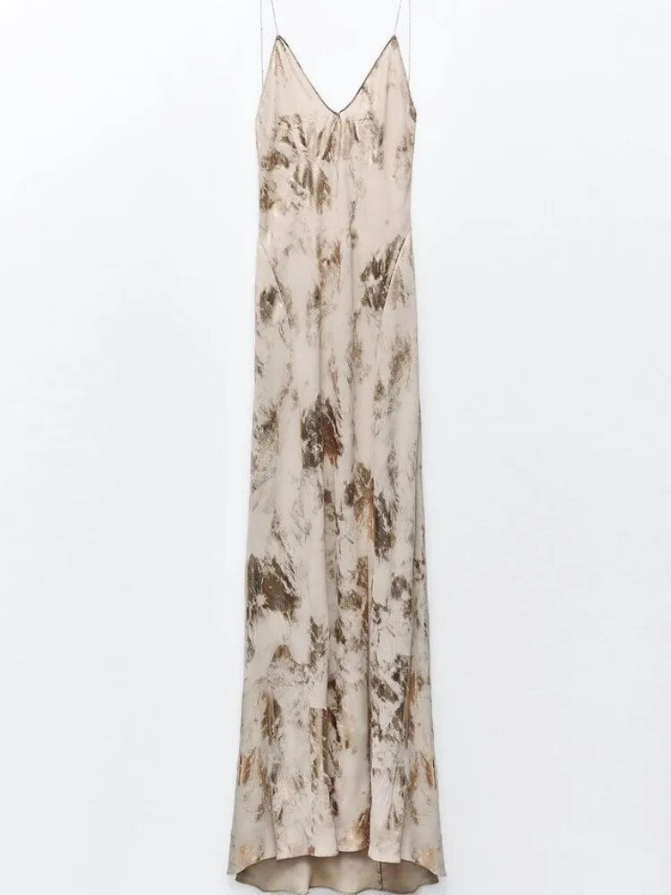 Zomerse dames feestjurk met open rug en diepe V-hals. Comfortabele en elegante mouwloze jurk voor elke gelegenheid.
