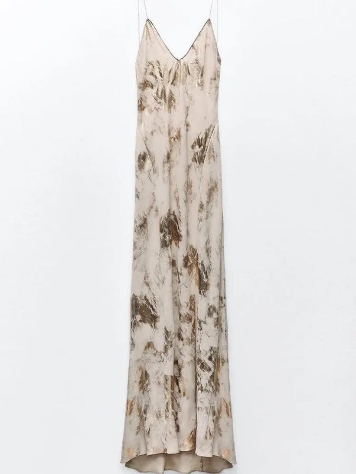 Zomerse dames feestjurk met open rug en diepe V-hals. Comfortabele en elegante mouwloze jurk voor elke gelegenheid.