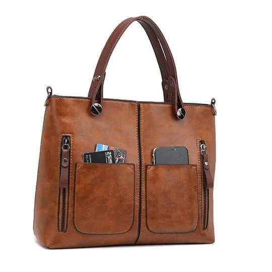 "Elegante vintage leren schoudertas voor dames met verfijnde stiksels en ruime opbergvakken, ideaal voor dagelijks gebruik."