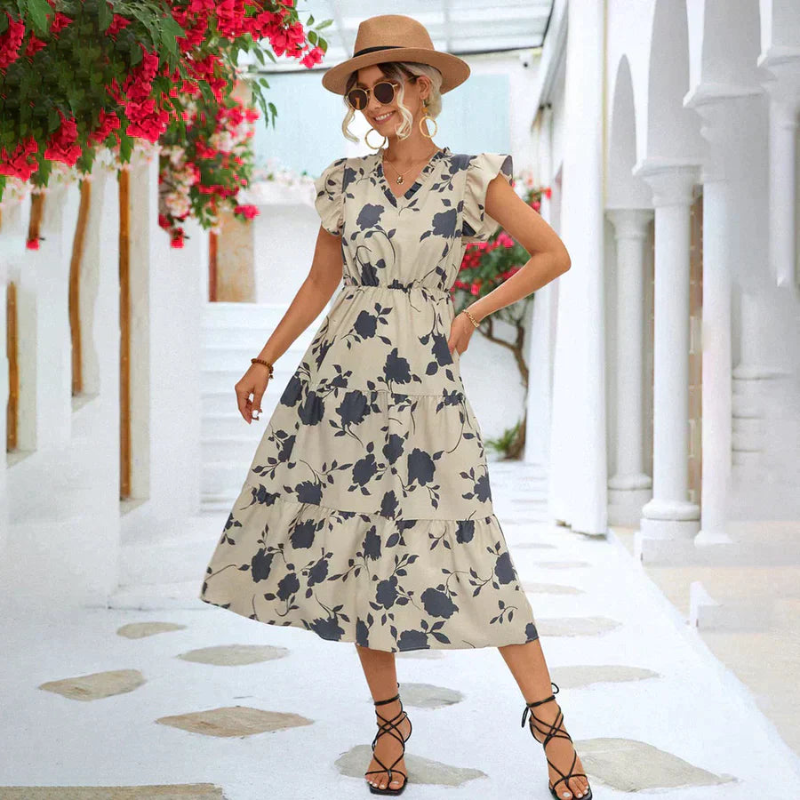 Elegante witte dames A-lijn zomerjurk met trendy pofmouwen en subtiele kleuraccenten, perfect voor elke gelegenheid.
