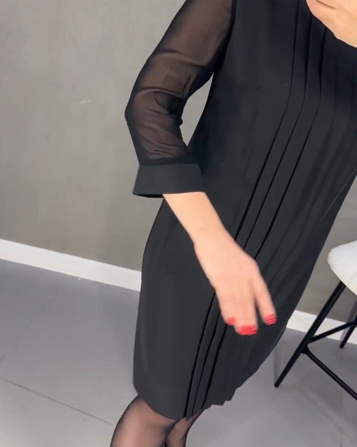 Trendy rode dames shiftjurk met lange mesh mouwen. Veelzijdig en comfortabel, ideaal voor diverse gelegenheden.