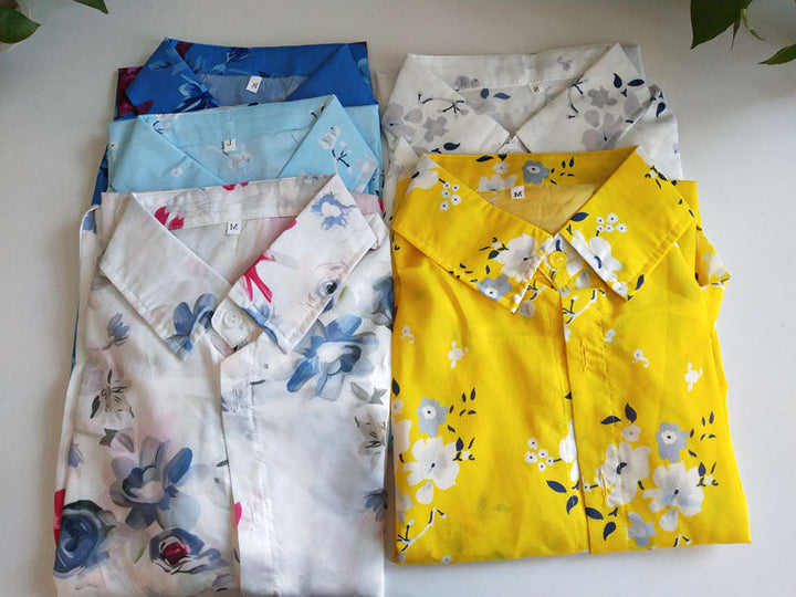 Subtiele kraag en knoopjes detail van de v-hals dames zomerblouse