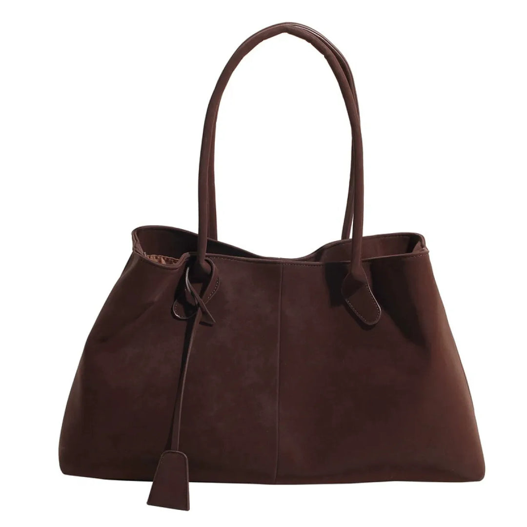 Zijaanzicht van de grote zwarte Renata schoudertas en tote bag met lange comfortabele hengsels