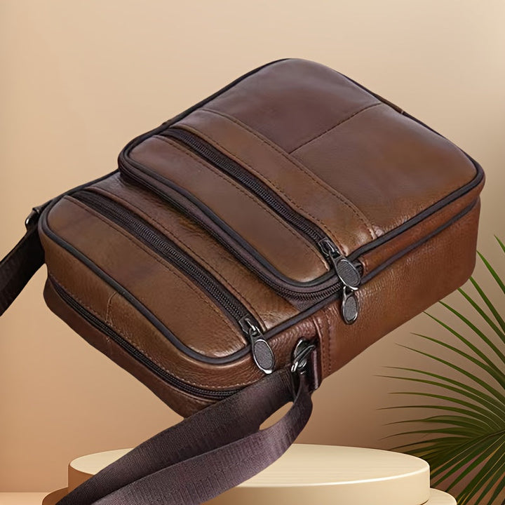Messenger bag heren in bruin runderleer, stijlvolle en verstelbare leren tas.