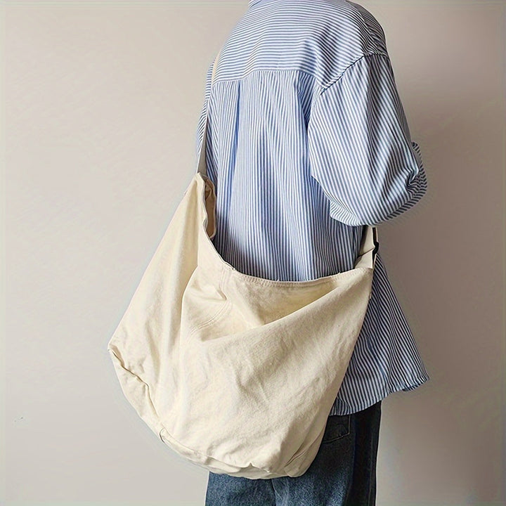 Duurzame heren crossbody tas, minimalistisch ontwerp voor dagelijks gebruik. Ruime schoudertas met brede, comfortabele riem.