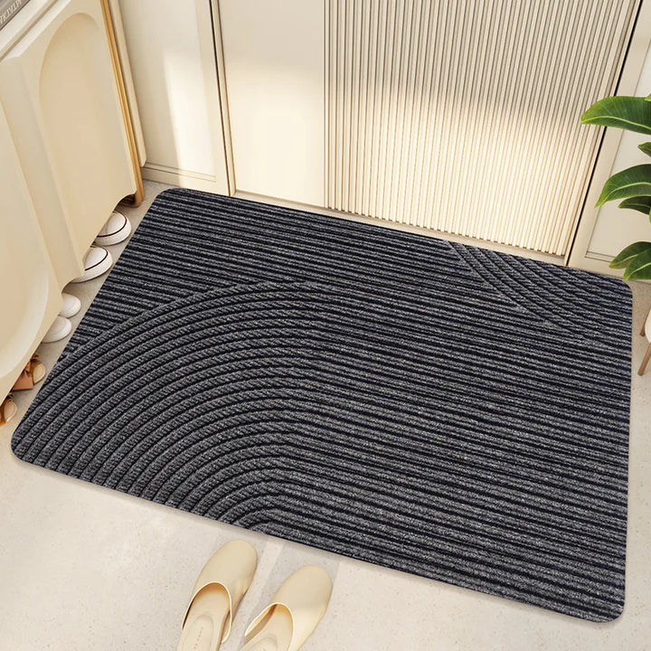 Duurzame buitenmat/binnenmat met geometrisch design. Houd je woning schoon met deze stijlvolle vuilafstotende deurmat.