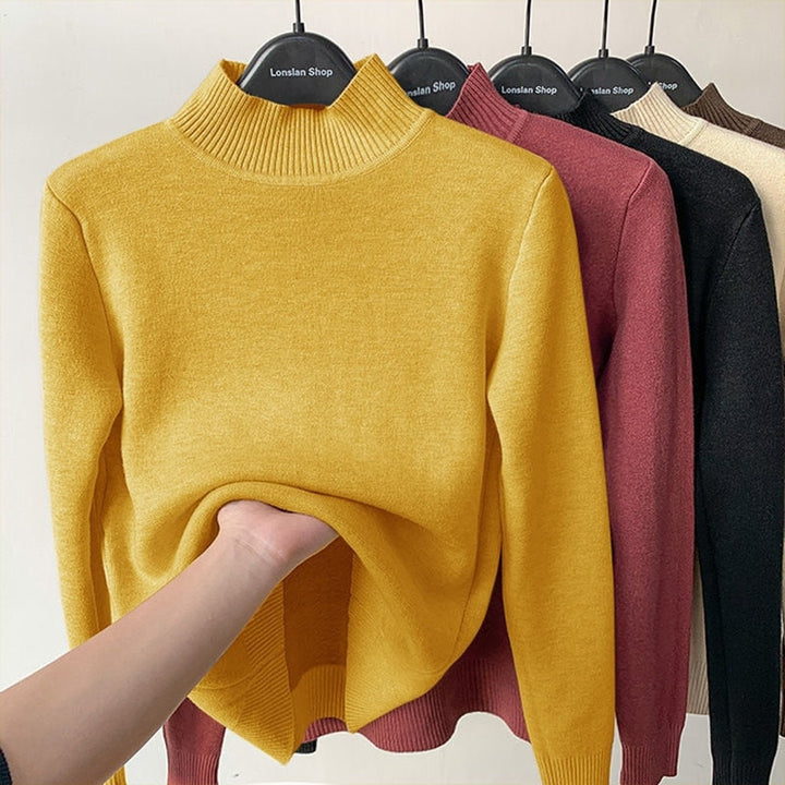 Voel de warmte met deze zacht gevoerde dames trui, perfect voor comfortabele winterse dagen.
