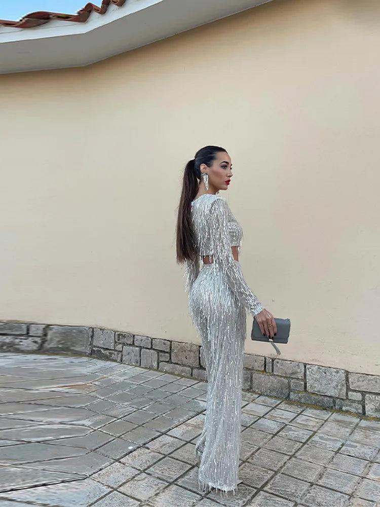 Glamoureuze dames pailletten set, perfecte feestkleding met een elegante high-waist broek en bijpassende top.