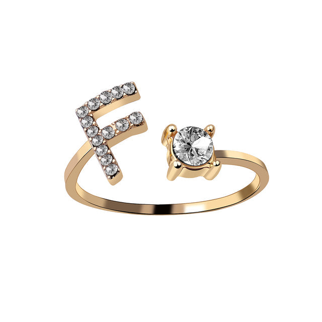 Letterring L in goud RVS, verstelbaar, modern en gepersonaliseerd.
