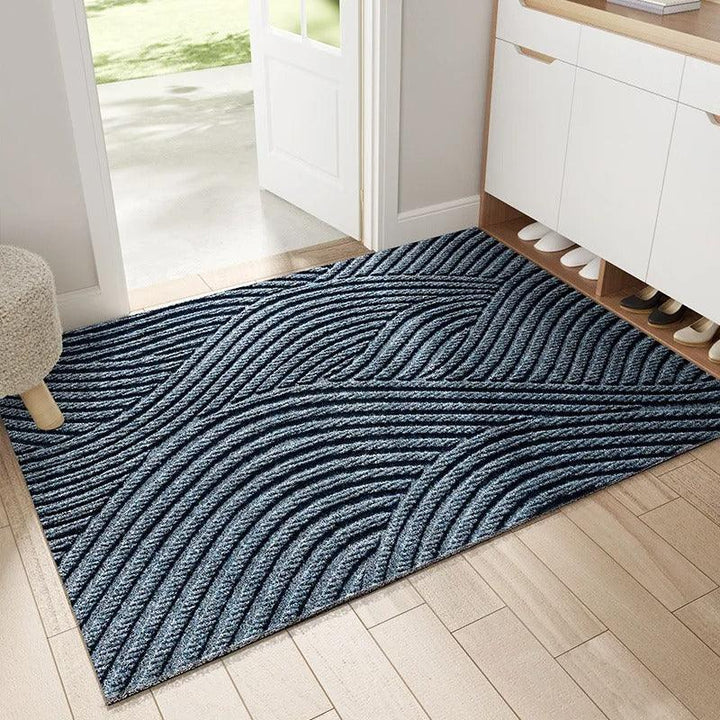 Grijze moderne deurmat, vuilvangend en zijden. Antislip voor veilige entree en huisdecoratie.
