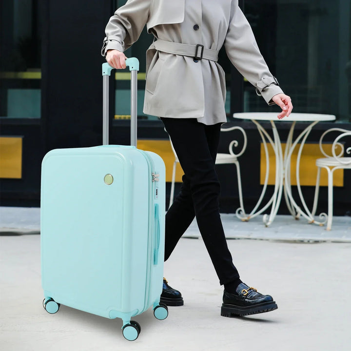 Stijlvolle hardshell kofferset in groen & roze met geïntegreerd cijferslot voor veilige reizen. Duurzame reiskoffers.