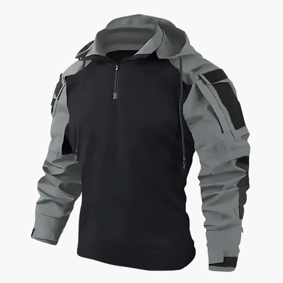 Stijlvolle blauwe outdoor heren jas, tactisch en winddicht. Biedt weerbestendige bescherming.