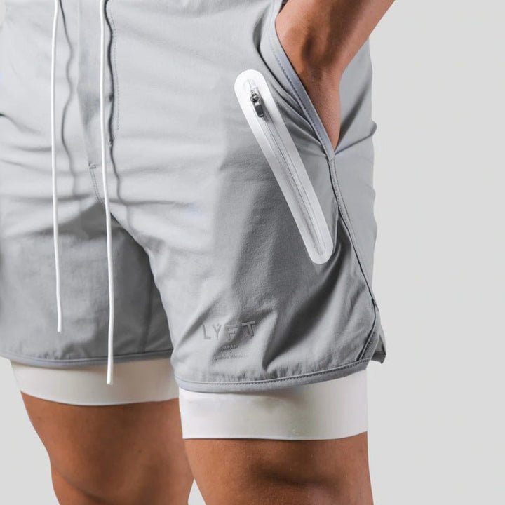 Stijlvolle heren 2-in-1 sportshorts, veelzijdige sportkleding met compressie voor elke workout of training.