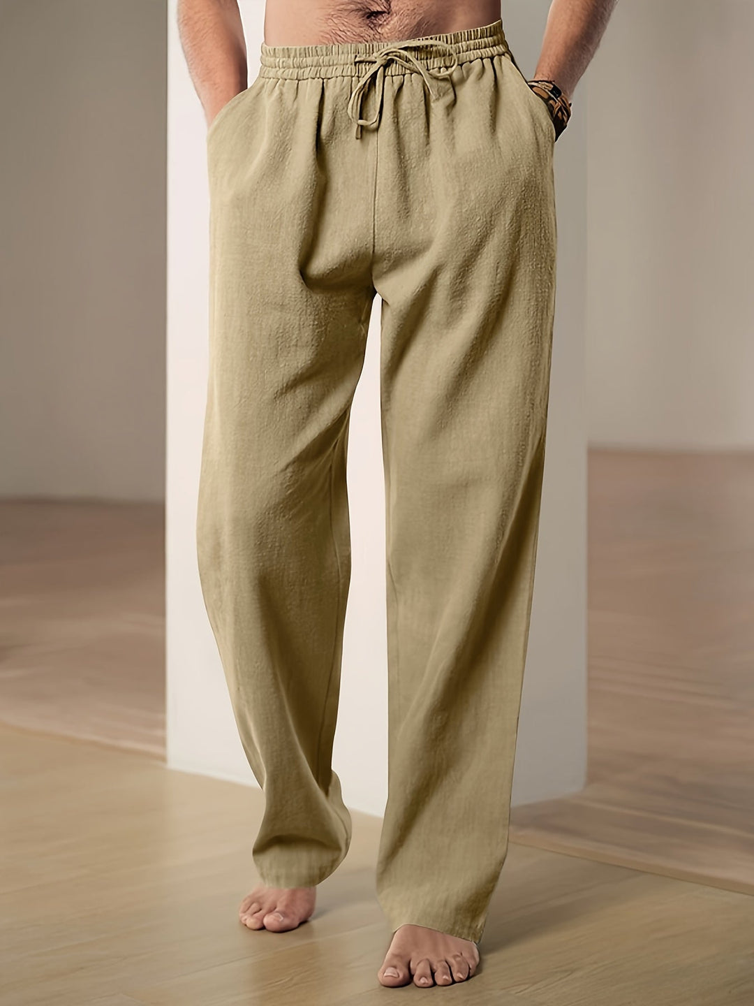 Casual herenbroek met trekkoord, wijde pijpen en relaxte pasvorm; perfect voor dagelijks comfort.