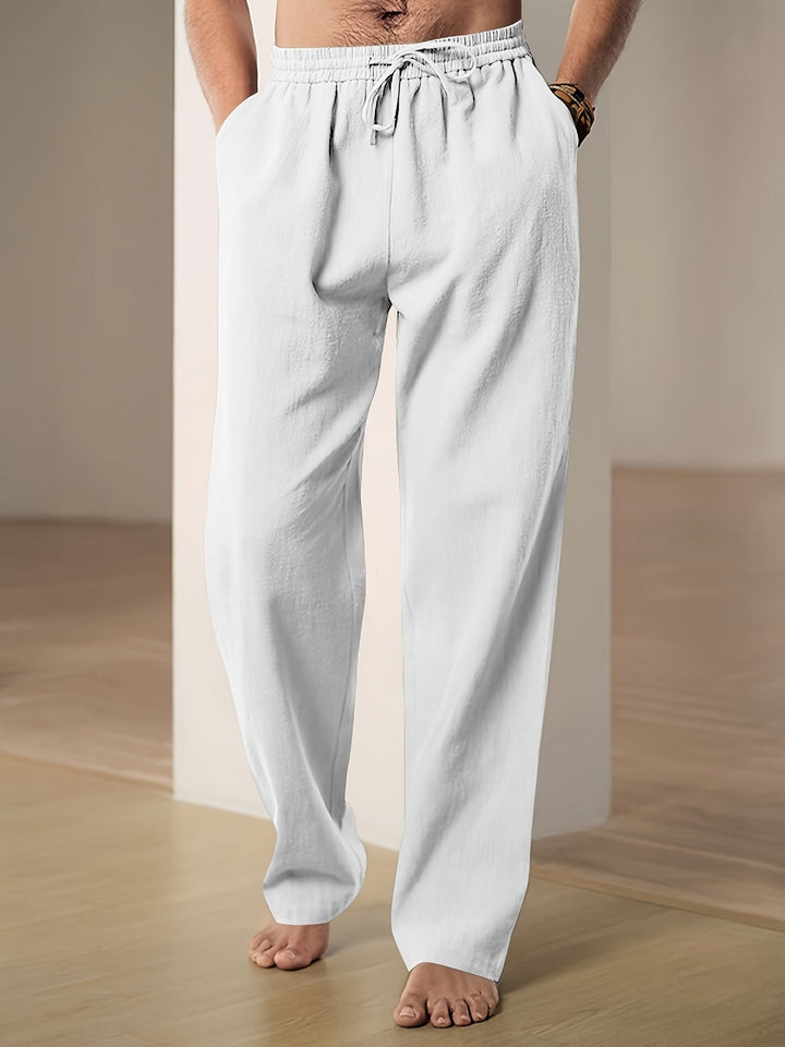 Stijlvolle herenbroek, type chino, met trekkoord en wijde pijpen voor ultiem draagcomfort.