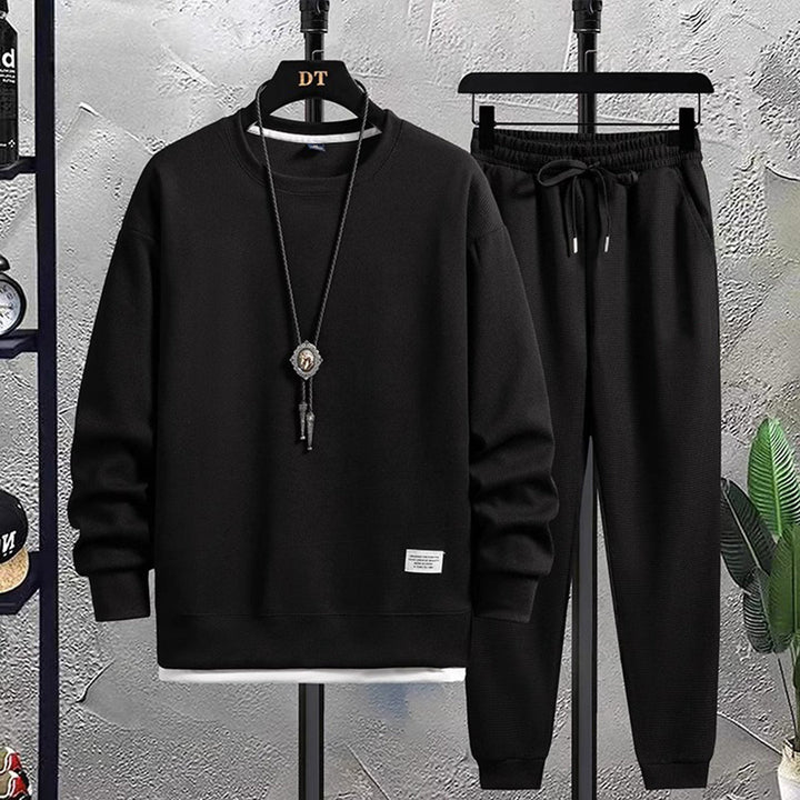 Zacht heren joggingpak, perfecte herenkleding voor ontspanning en casual activiteiten. Stijlvol en veelzijdig.