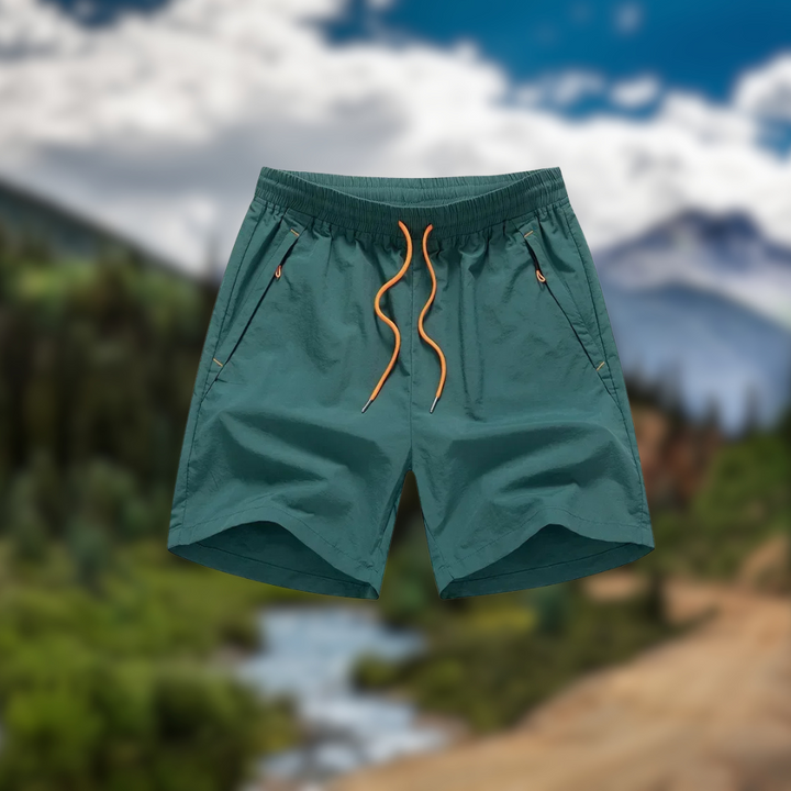 Heren hardloopshorts Nikoas met comfortabele mesh binnenbroek en veilige ritszakken, perfect voor training.