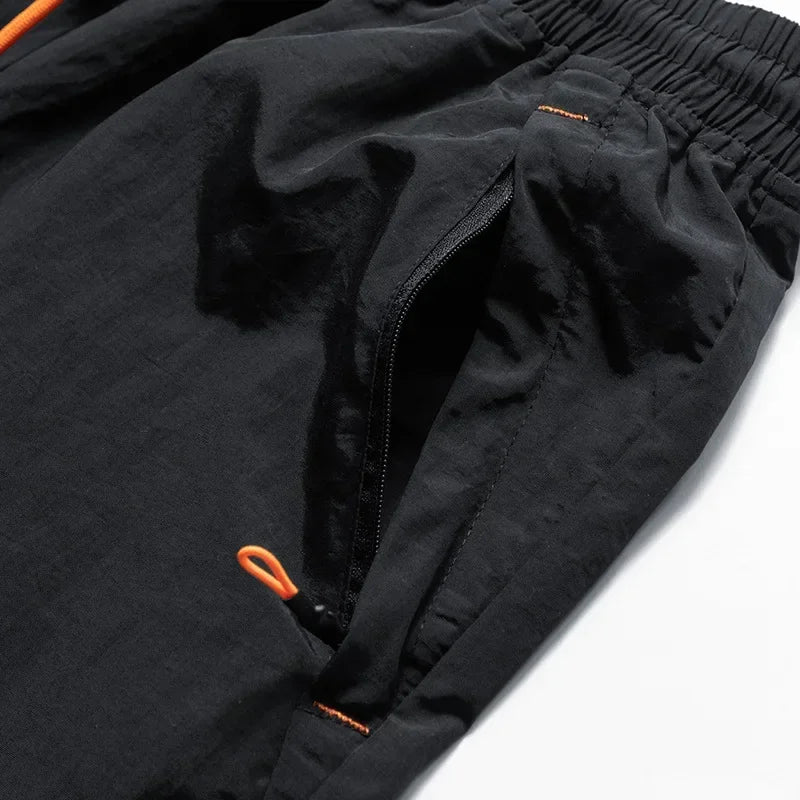 Nikoas heren hardloopshorts, veelzijdige fitness- en vrijetijdskleding met veilige ritszakken voor dagelijks gebruik.