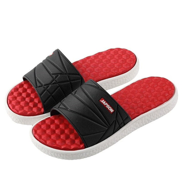 Zwarte heren slippers met ergonomisch design voor optimale drukverdeling.