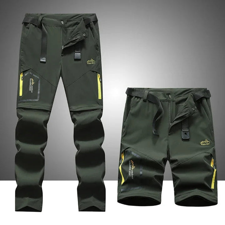 Man draagt flexibele afritsbare outdoorbroek tijdens wandeling; sneldrogend, stretch en comfortabel.