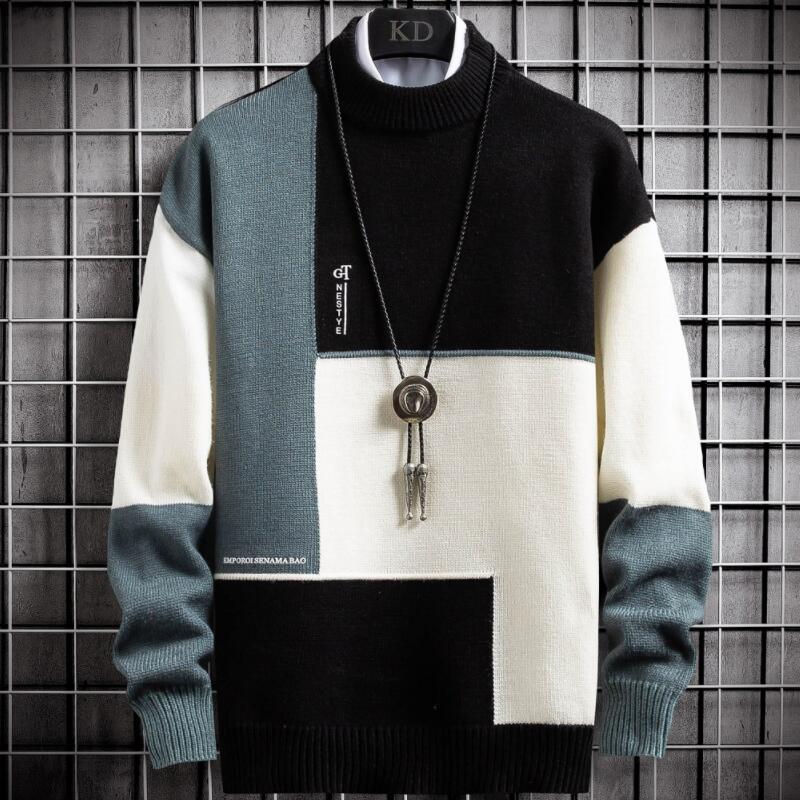 Heren patchwork pullover in groen, zwart en lichtpaars. Comfortabele warme sweater met ronde hals voor winter.