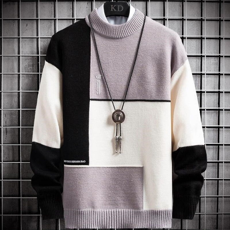 Warme heren sweater met uniek patchwork design. Comfortabele pullover met ronde hals in groen, zwart, lichtpaars.