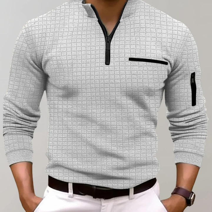 Stijlvolle heren polo met ritssluiting, perfecte bovenkleding voor een moderne, sportieve lente/zomeroutfit.