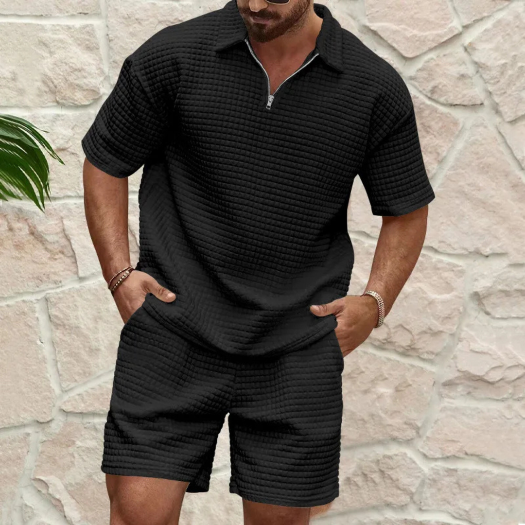 Donkerblauwe heren zomerset met korte mouw, ritskraag polo en comfortabele shorts