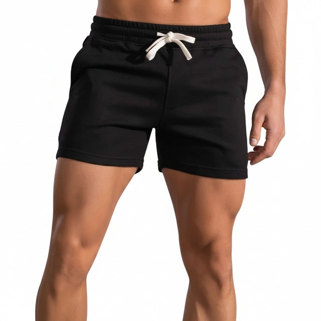 Zwarte herenshorts met elastische taille en trekkoord, ideaal voor comfortabele zomerkleding en vrije tijd.