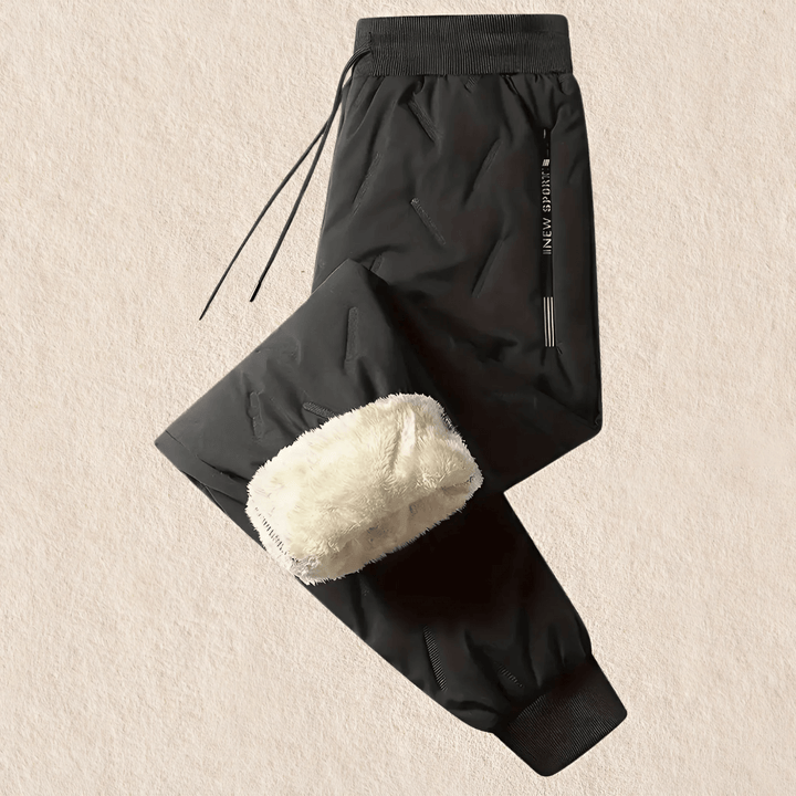 Grijsblauwe herenbroek thermisch, water- en winddicht, ideaal voor outdoor avonturen en bescherming tegen kou.