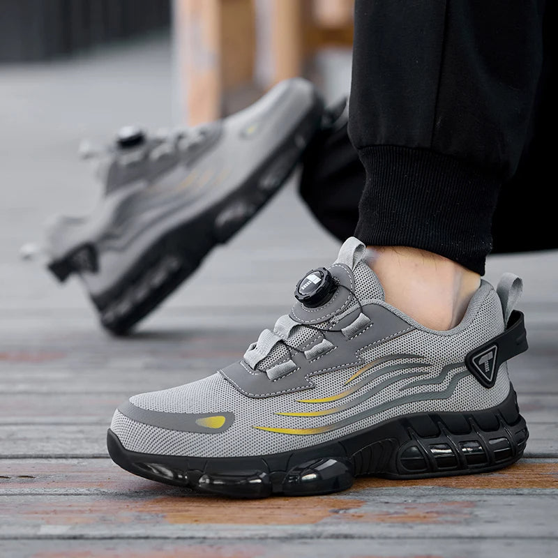 Grijze heren veiligheidsschoenen met stalen neus, antislipzool en comfortabele draaiknopsluiting.