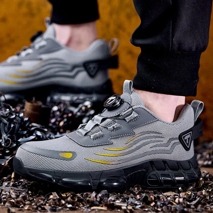 Comfortabele heren veiligheidssneakers, zwart/grijs, met stalen neus voor optimale voetbescherming.