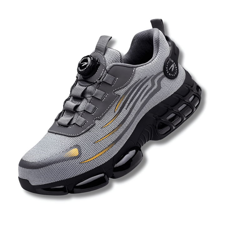 Paar heren veiligheidssneakers, grijs/zwart, met stalen neus en draaiknop voor veilige werkomgeving.