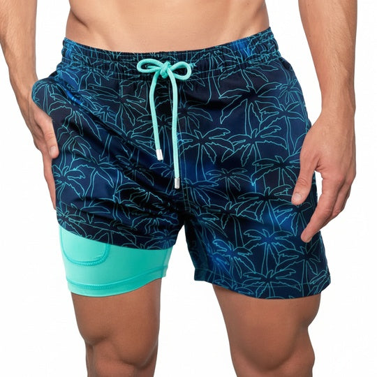 Heren zwembroek met tropische palmbomen print en turquoise binnenbroek