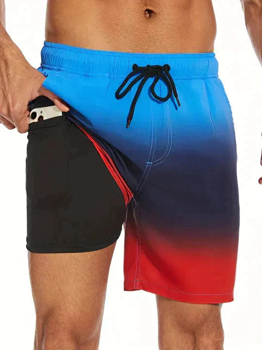 Stijlvolle herenzwembroek met exotisch bladenmotief en elastische tailleband.
