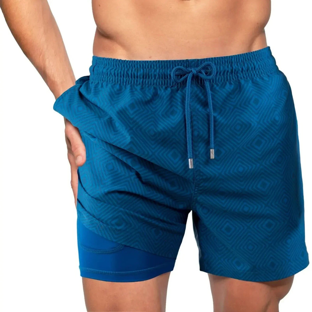Blauwe heren zwemshorts met compressiebroek voor sport, zwemmen en strand. Comfortabel en sneldrogend.