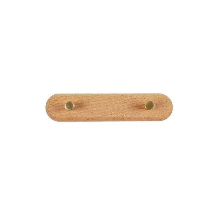 Houten wandgarderobe met messing kapstokhaken, praktisch en decoratief voor je entree.