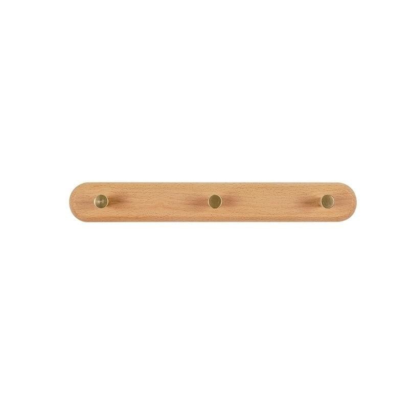 Luxe houten wandkapstok met zes messing haken, voor een geordend en stijlvol interieur.