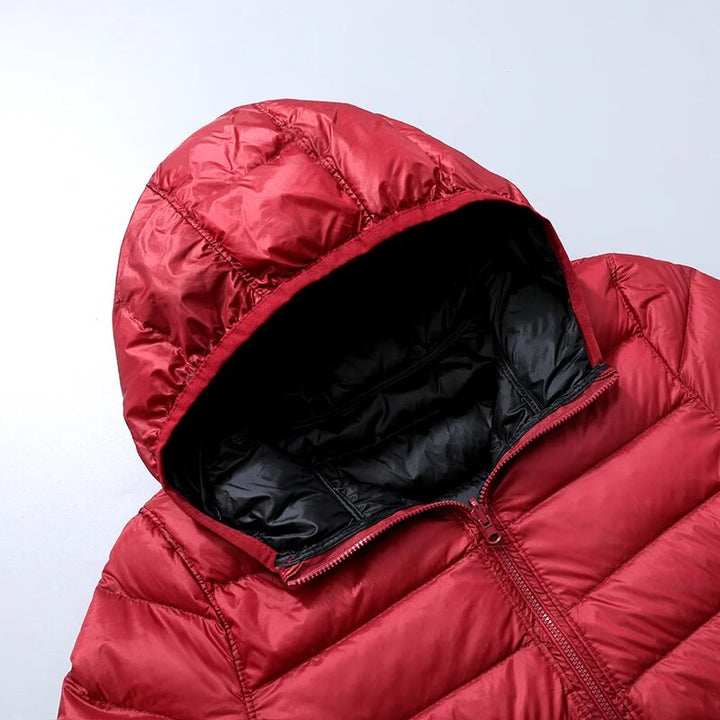 Hoymans damesjas: capuchon donsjas, comfortabel en modieus voor de winter.