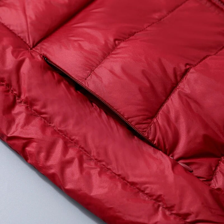 Trendy dames donsjas met capuchon, lichtgewicht en warm voor winterse outfits.