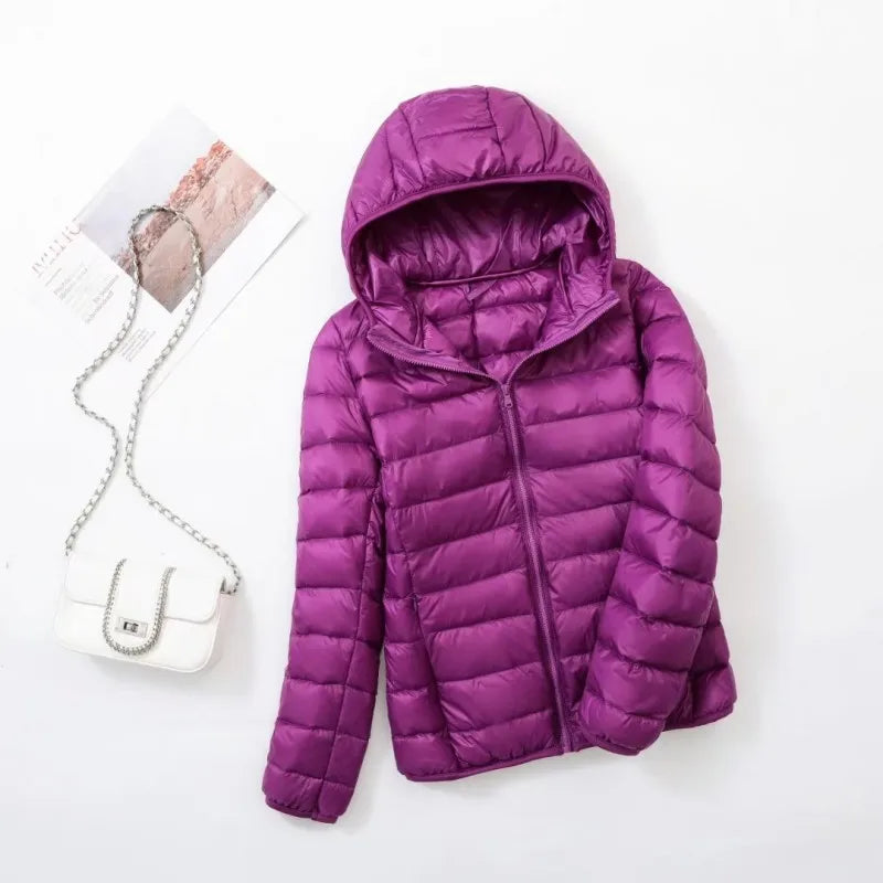 Essentiële winterjas voor dames: Hoymans donsjas met warme capuchon.
