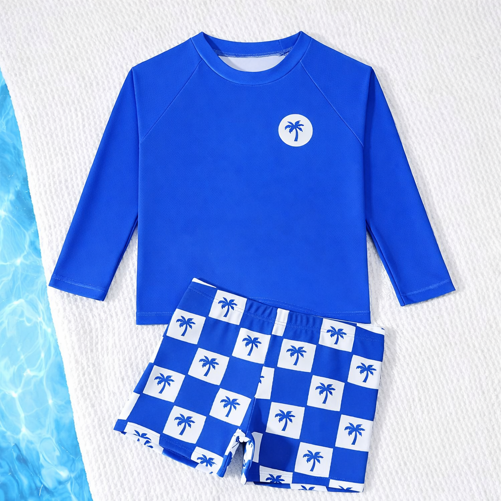 Kleurrijke kinderzwemkleding: jongen rashguard en zwemshort, ideaal voor strand en zwembad.