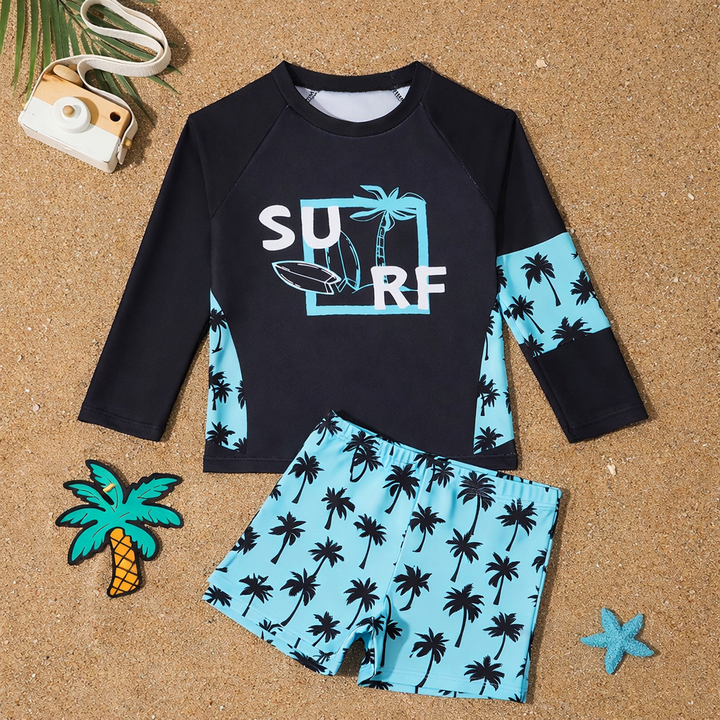 Blauwe jongens zwemkleding: rashguard en zwemshort met UV-bescherming, klaar voor waterpret.