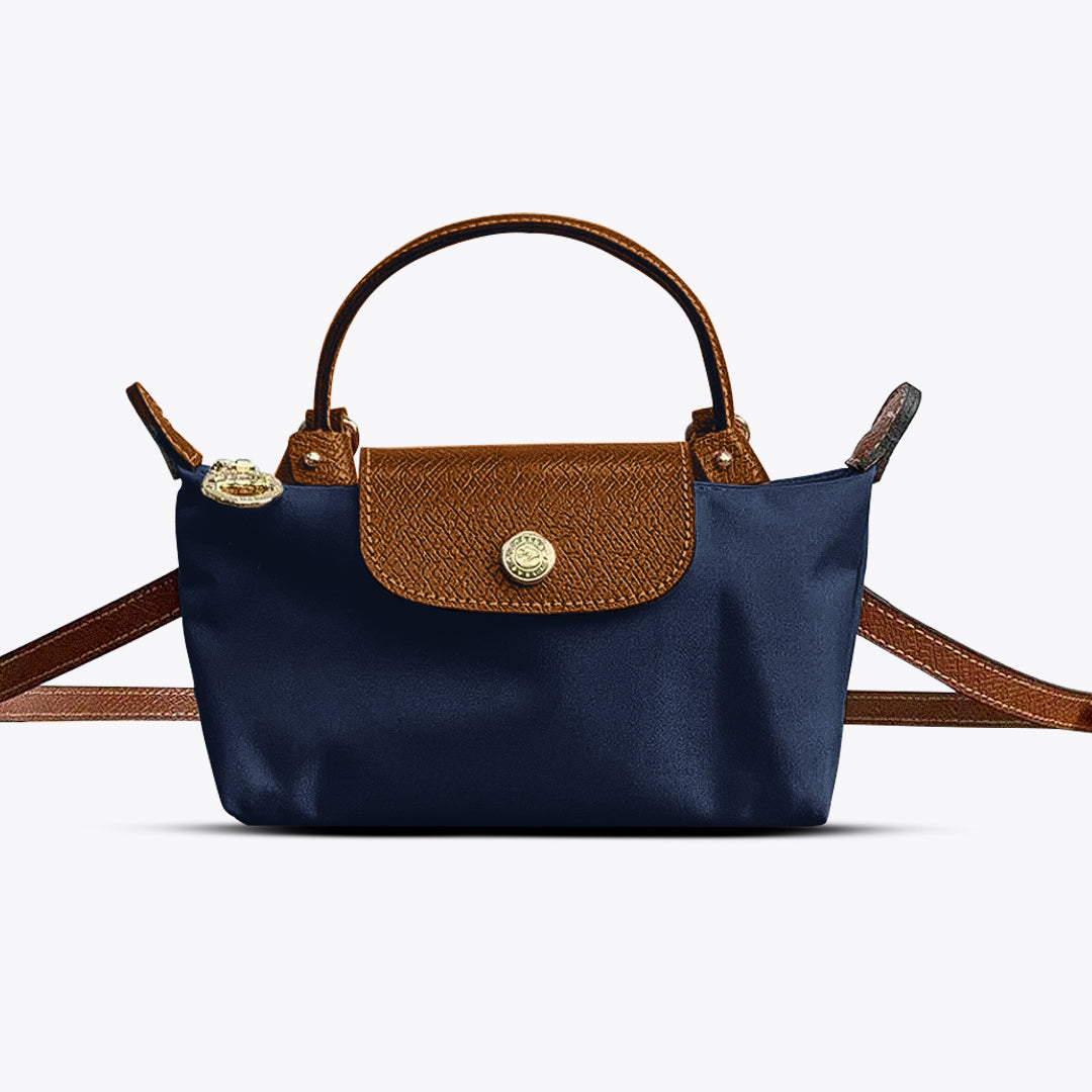 Blauwe mini handtas met stijlvolle schouderriem en goudkleurige details