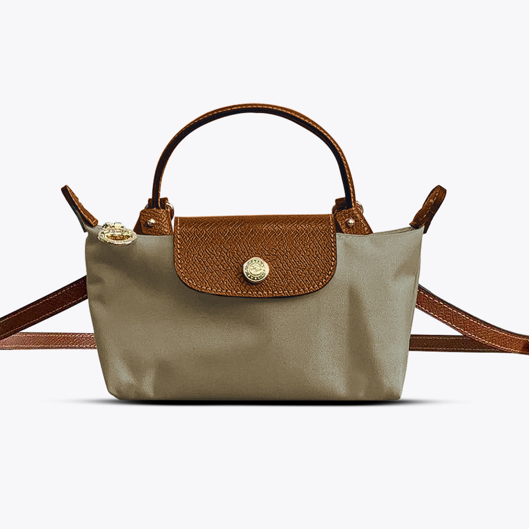 Details van de compacte dames schoudertas met handvat