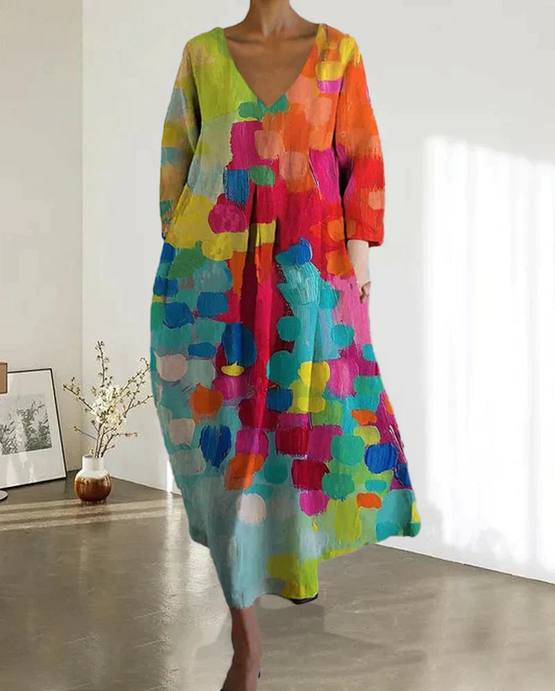 Casual kleurrijke bedrukte lentejurk voor dames met een moderne V-hals. Comfortabele en elegante zomerjurk Kim.