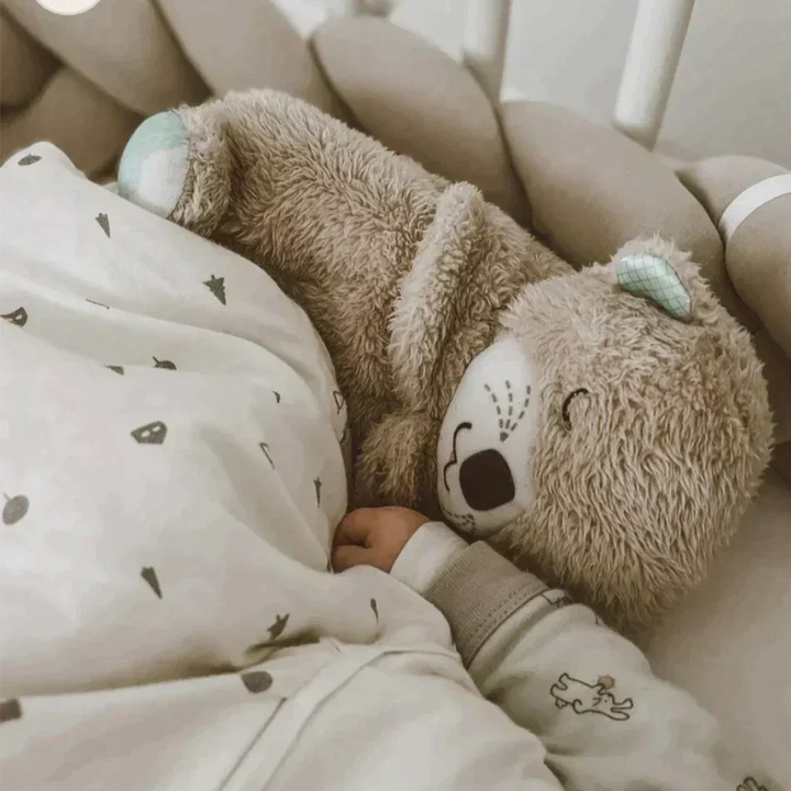 Zacht knuffeldier otter voor baby's, stimuleert rust met ademhalingsbewegingen en rustgevende slaapmelodieën.