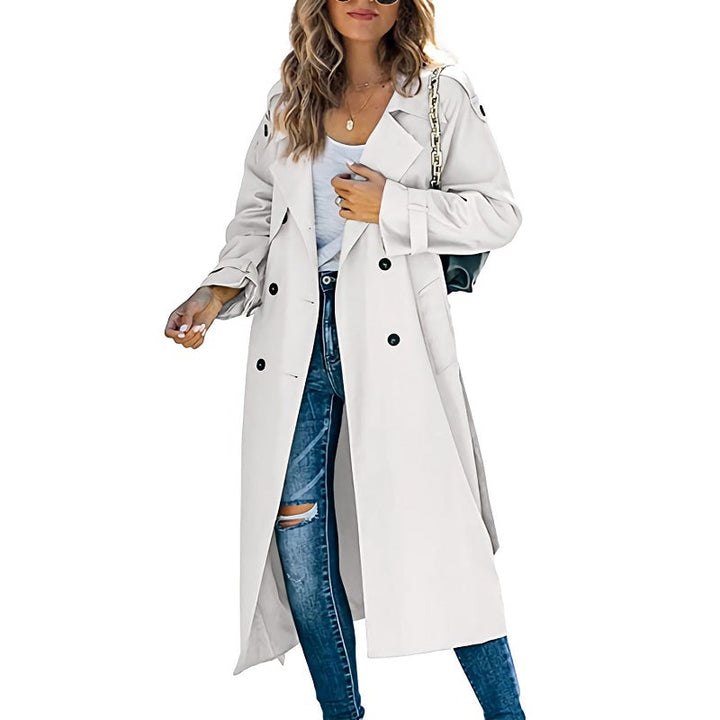 Lange dames trenchcoat, stijlvol en tijdloos, perfect voor overgangsseizoenen zoals voorjaar en najaar.